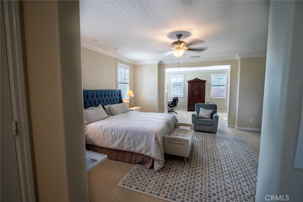 26424 Township Street Saugus, CA 91350 - Photo 59 of 72 a bedroom with a bed and a chandelier