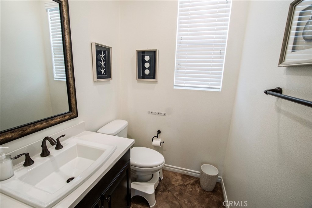 26424 Township Street Saugus, CA 91350 - Photo 61 of 72 a bathroom with a sink mirror and toilet