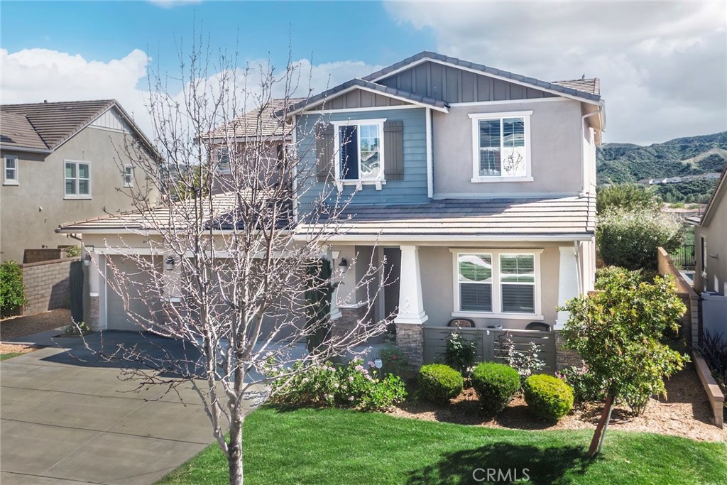 26424 Township Street Saugus, CA 91350 - Photo 69 of 72 a front view of a house with a garden
