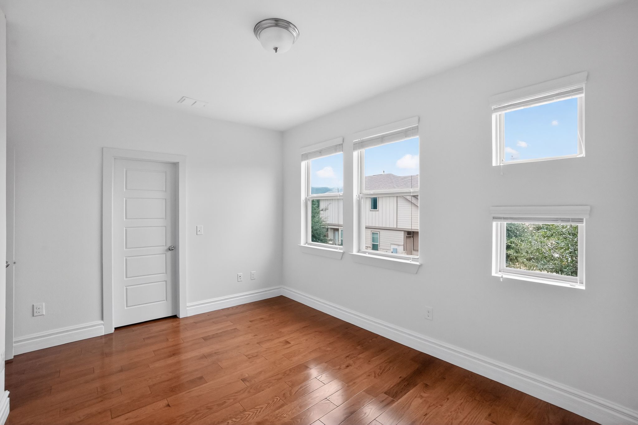 9717 Briny Shell Way Austin, TX 78748 - Photo 4 of 16 Unfurnished room with baseboards and hardwood / wood-style flooring