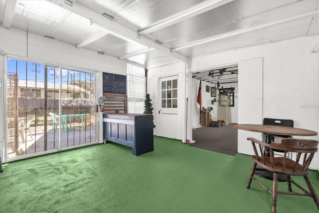 312 East Main Street Dundee, FL 33838 - Photo 11 of 27 a dining room with furniture and a floor to ceiling window