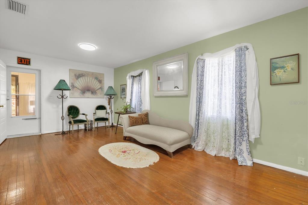 312 East Main Street Dundee, FL 33838 - Photo 16 of 27 a living room with furniture and a wooden floor