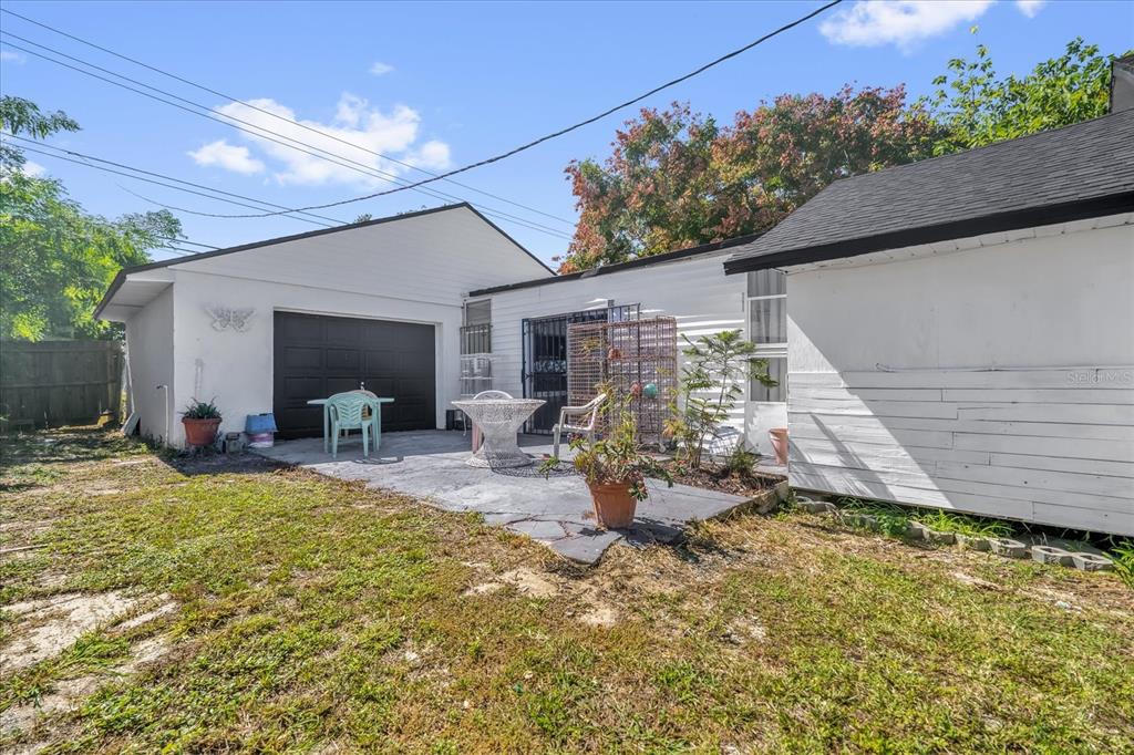 312 East Main Street Dundee, FL 33838 - Photo 20 of 27 a view of a house with backyard and sitting area