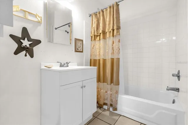 a view of a room with furniture and a window