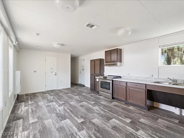a view of a bathroom with wooden floor