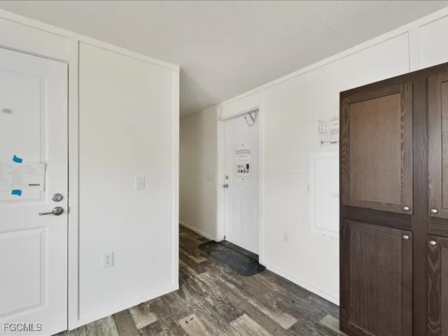 a view of wooden floor and wardrobe