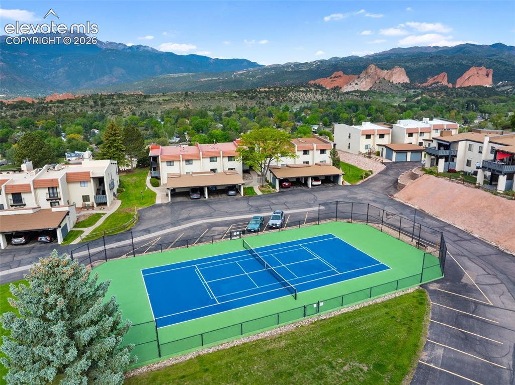 1018 Fontmore Road, Unit A Colorado Springs, CO 80904 - Photo 28 of 28 a backyard of a house with table and chairs