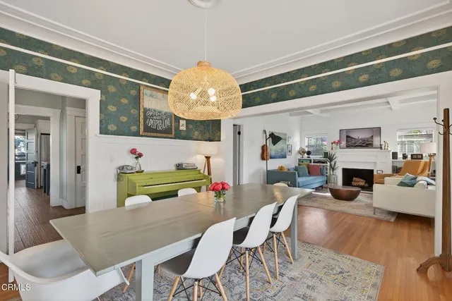 a living room with furniture toys and a book shelf
