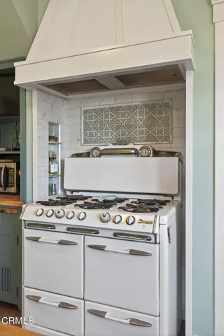 a utility room with sink dryer and washer