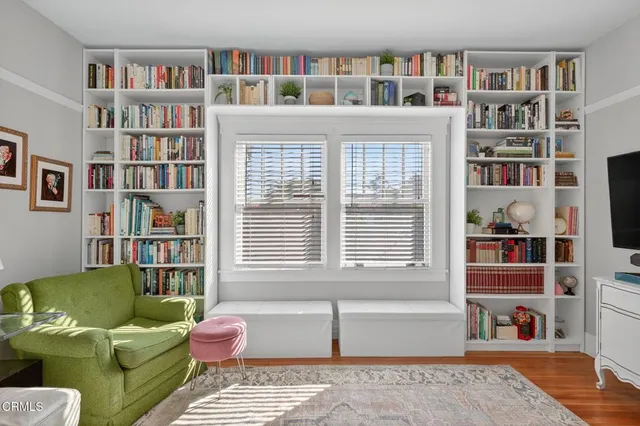 a view of a chairs and table in a backyard
