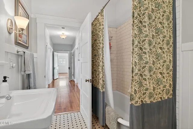 a view of a backyard with plants and a patio