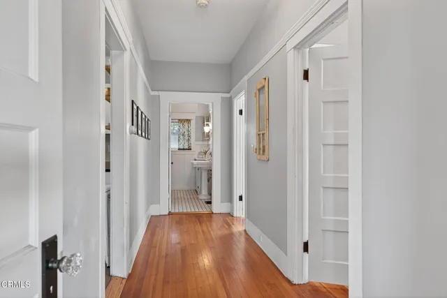 a view of a patio with table and chairs potted plants