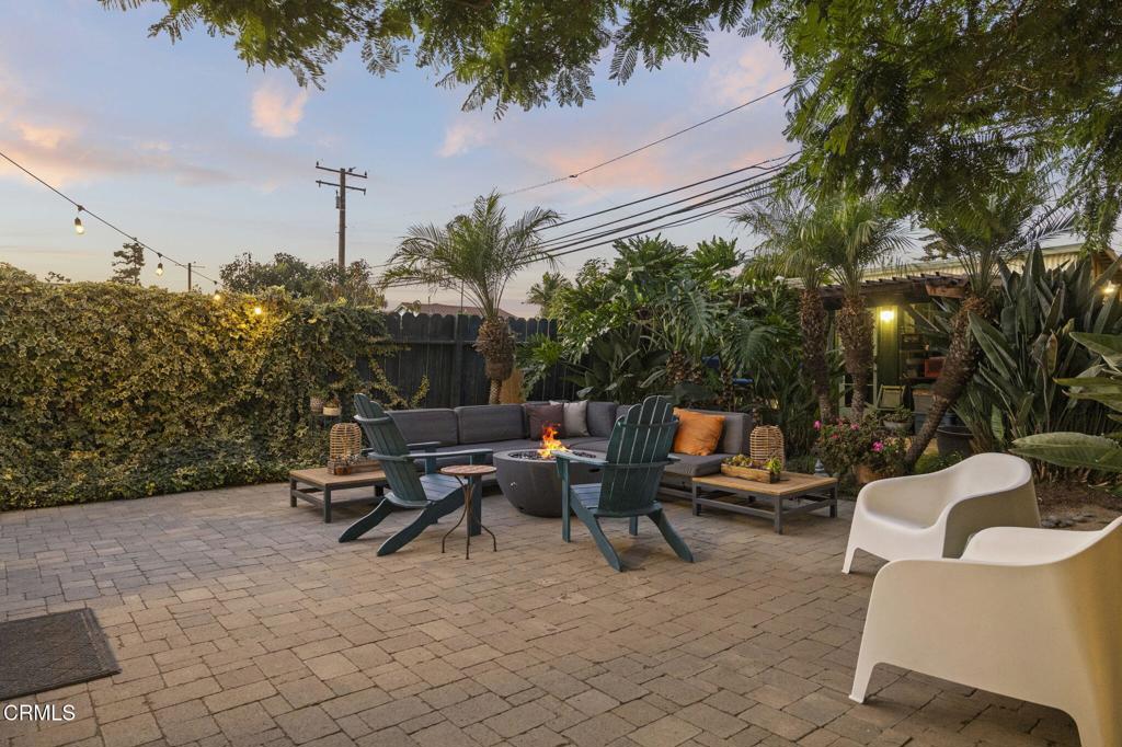 407 Magnolia Avenue Oxnard, CA 93030 - Photo 7 of 76 a roof deck with table and chairs potted plants with wooden fence