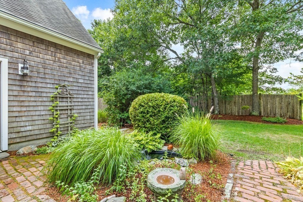 512 County Road Marion, MA 02738 - Photo 26 of 34 a view of a backyard with plants and large tree