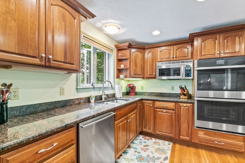 512 County Road Marion, MA 02738 - Photo 8 of 34 a kitchen with stainless steel appliances granite countertop a sink stove and cabinets