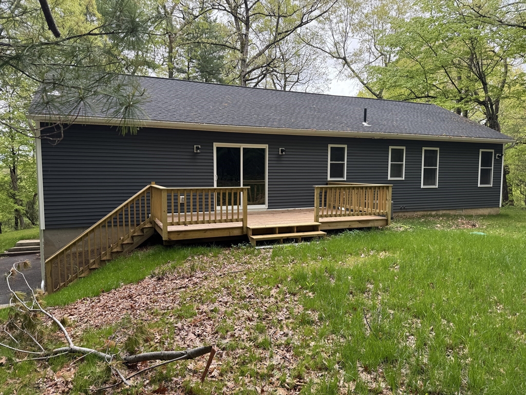 132 Kibbe Road East Longmeadow, MA 01028 - Photo 6 of 32 a view of a house with a yard porch and wooden fence