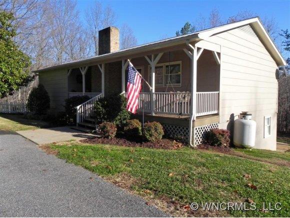 682 South Mountain Road Bostic, NC 28018 - Photo 1 of 12 a front view of a house with garden