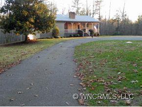 682 South Mountain Road Bostic, NC 28018 - Photo 12 of 12 a front view of a house with garden