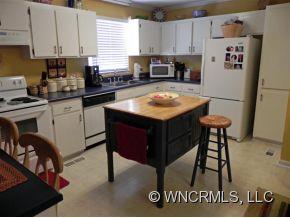 682 South Mountain Road Bostic, NC 28018 - Photo 3 of 12 a kitchen with a sink a stove and a refrigerator