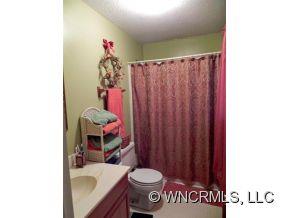 682 South Mountain Road Bostic, NC 28018 - Photo 6 of 12 a bathroom with a sink toilet and shower