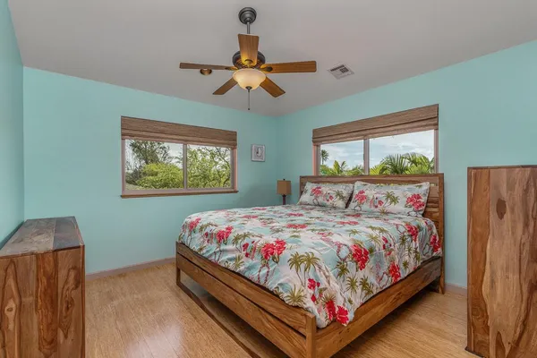 a bedroom with bed and window