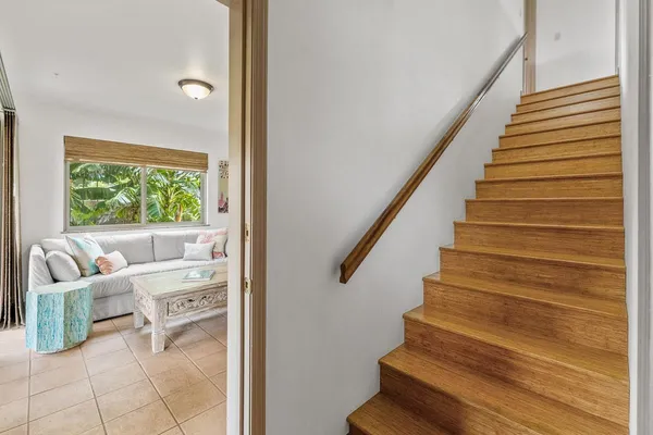 a view of entryway and hall with wooden floor