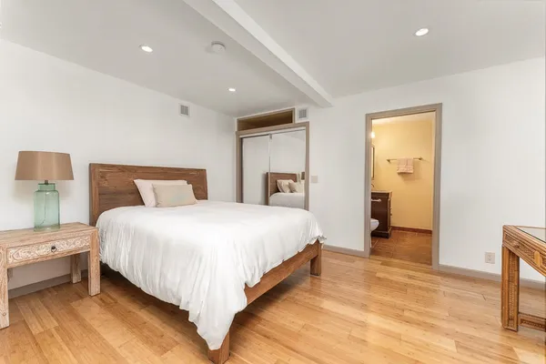 a bedroom with a bed and a table