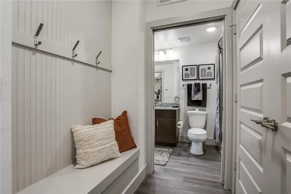 a bathroom with a toilet and a shower