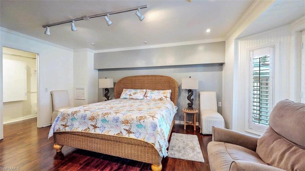 14524 Riverside Drive Fort Myers, FL 33905 - Photo 12 of 23 a bedroom with a bed couch and a window