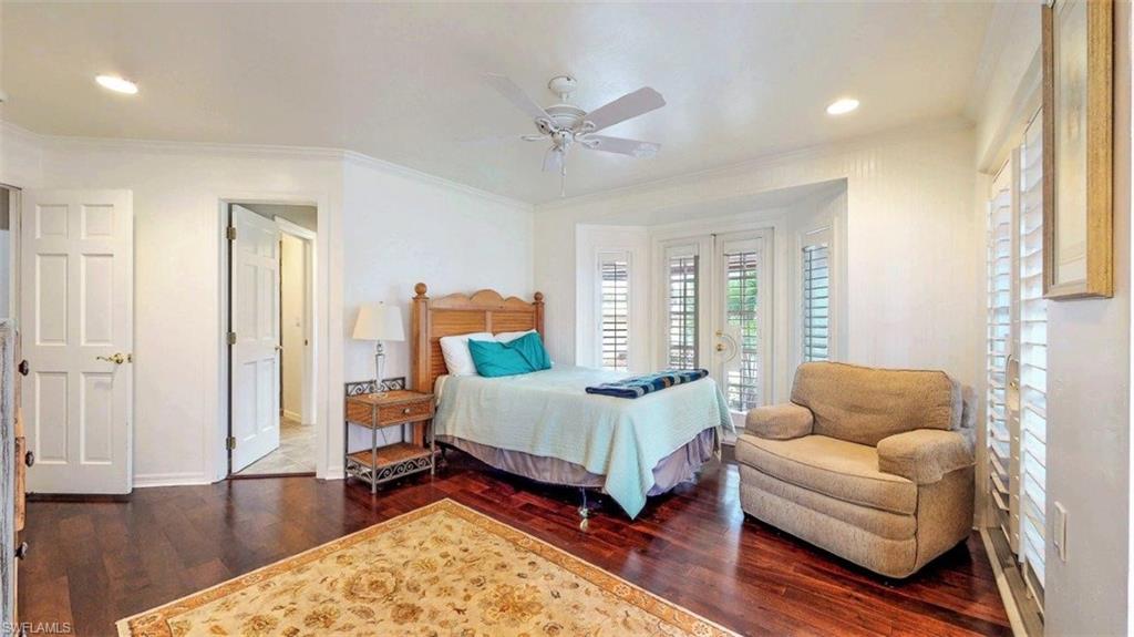 14524 Riverside Drive Fort Myers, FL 33905 - Photo 13 of 23 a spacious bedroom with a bed and a couch