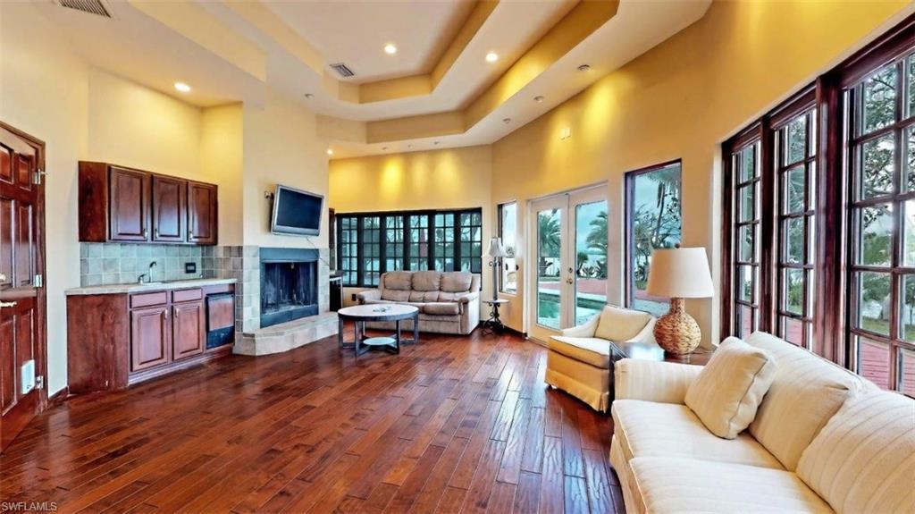 14524 Riverside Drive Fort Myers, FL 33905 - Photo 16 of 23 a living room with furniture and a fireplace