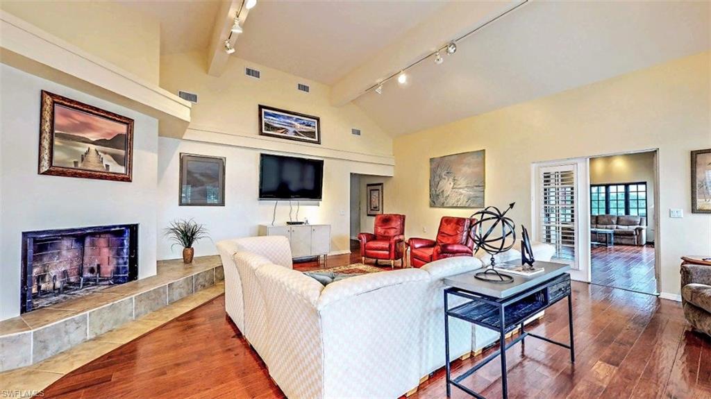 14524 Riverside Drive Fort Myers, FL 33905 - Photo 17 of 23 a living room with fireplace furniture and a flat screen tv