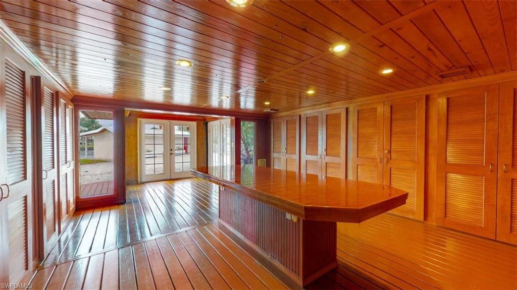 14524 Riverside Drive Fort Myers, FL 33905 - Photo 18 of 23 a view of entryway with a large window and wooden floor
