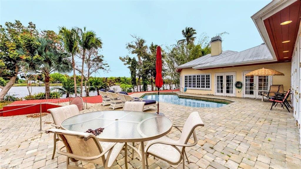 14524 Riverside Drive Fort Myers, FL 33905 - Photo 6 of 23 a view of a house with swimming pool and sitting area