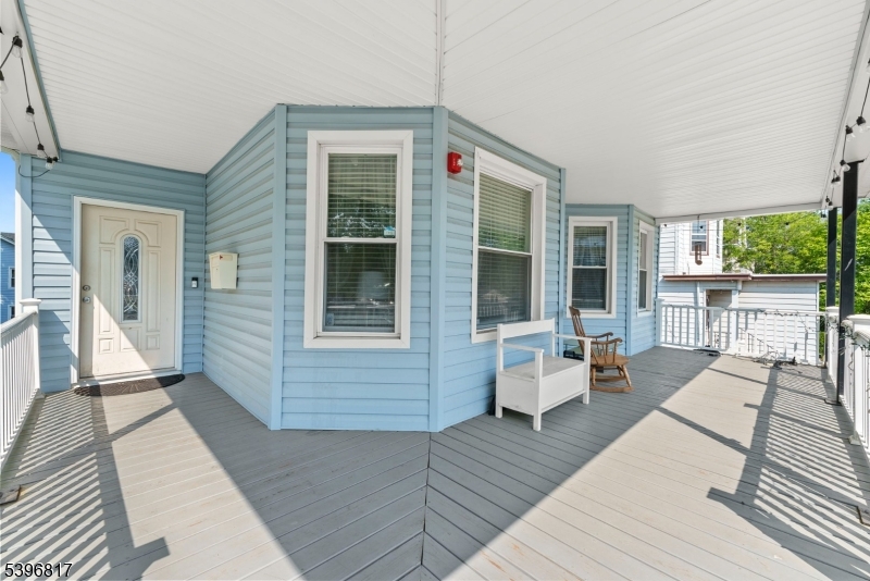 a front view of a house with barbeque oven