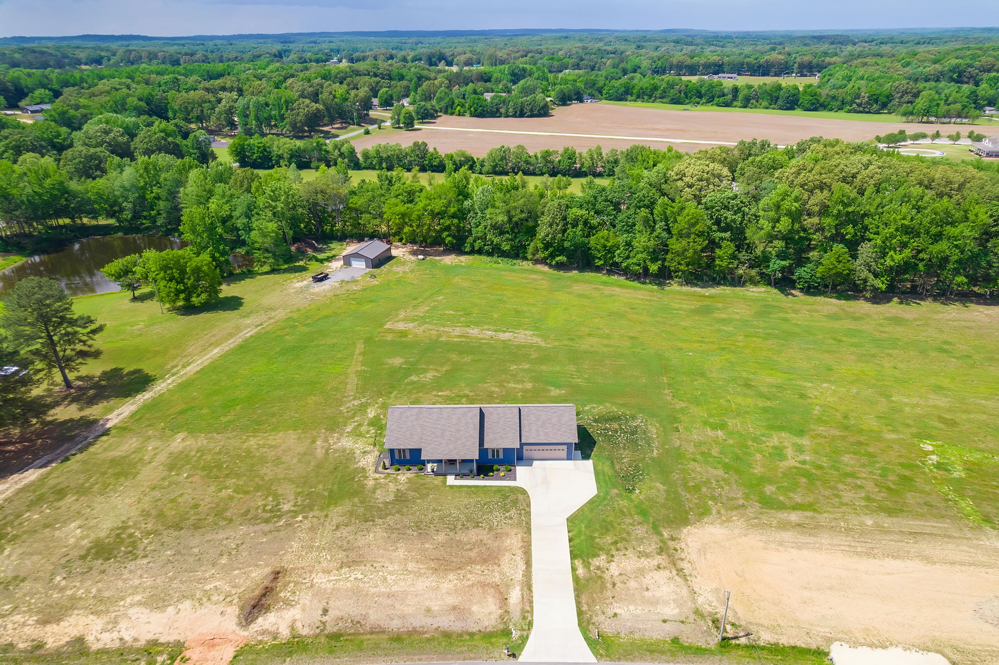 745 Alman Cemetery Road Paris, TN 38242 - Photo 29 of 31 a view of a lake with a yard