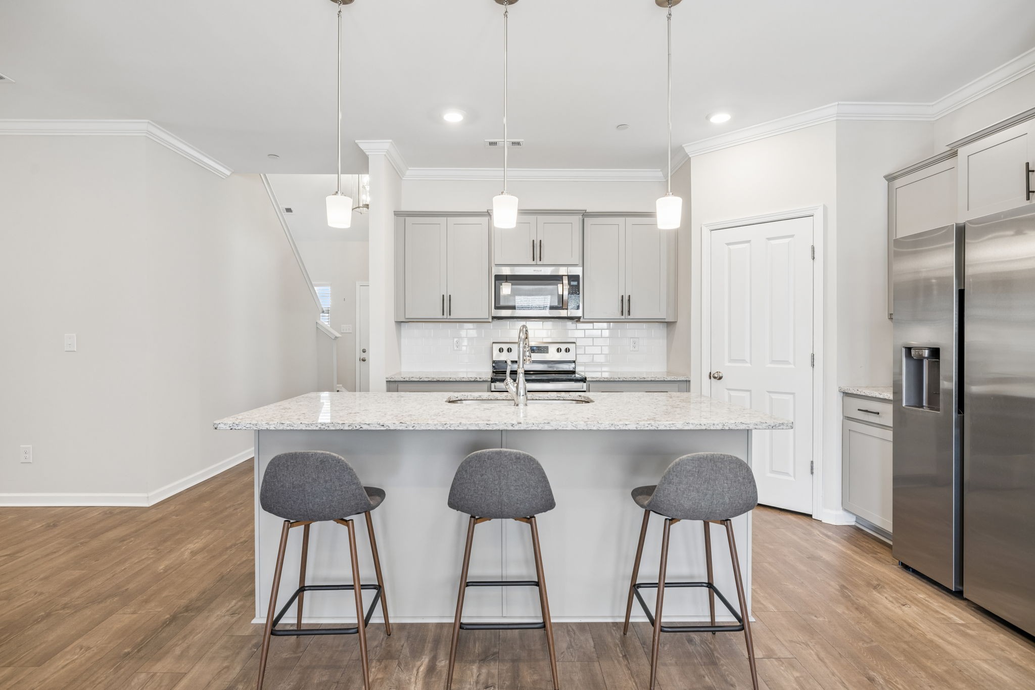 7503 Fernvale Springs Way Fairview, TN 37062 - Photo 16 of 60 a kitchen with kitchen island white cabinets and stainless steel appliances
