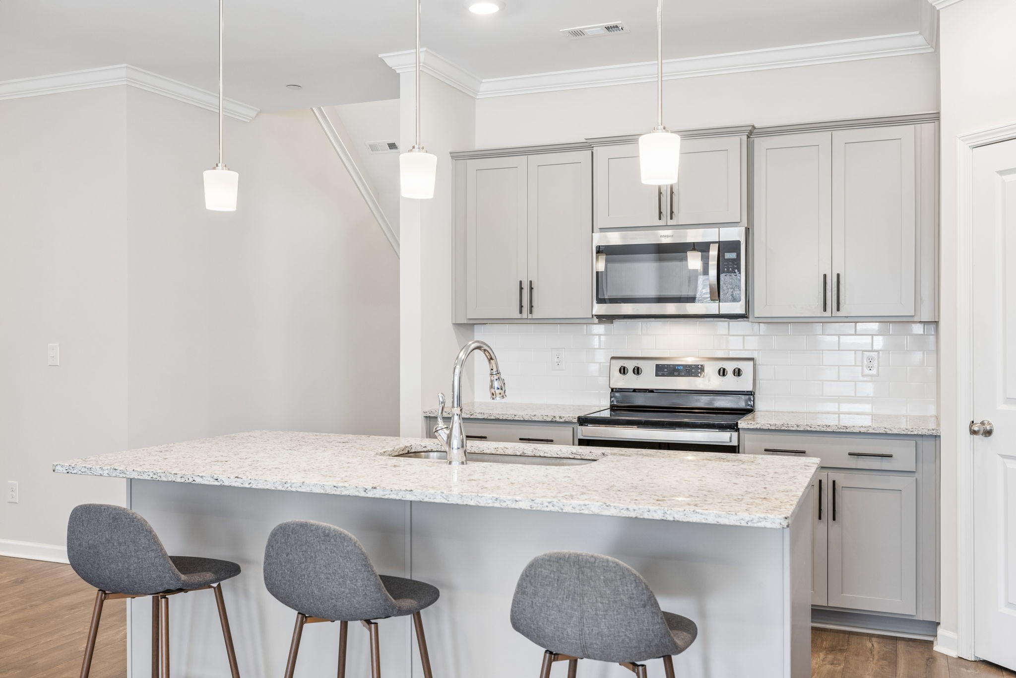 7503 Fernvale Springs Way Fairview, TN 37062 - Photo 19 of 60 a kitchen with stainless steel appliances a sink a stove a table and chairs