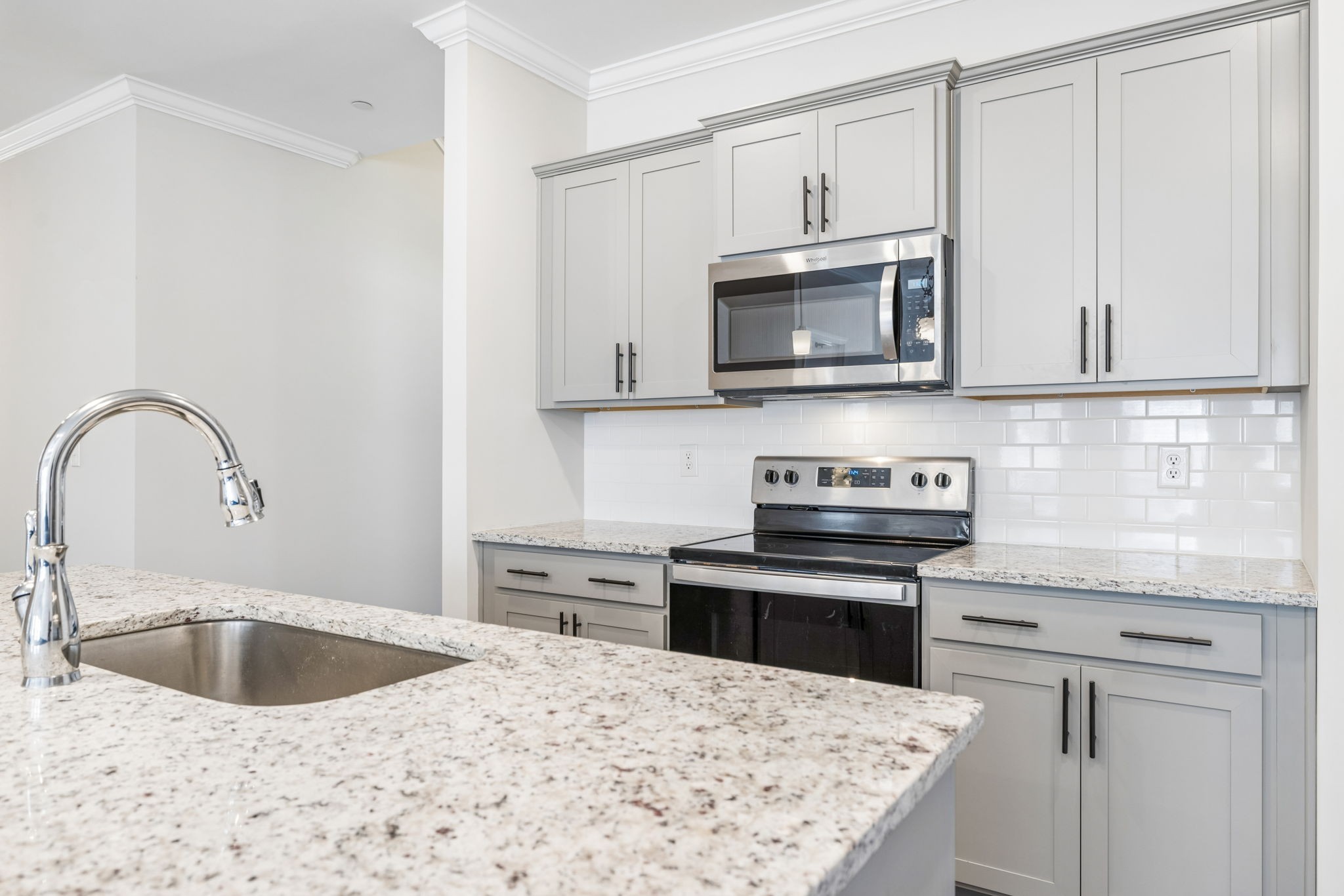 7503 Fernvale Springs Way Fairview, TN 37062 - Photo 22 of 60 a kitchen with granite countertop a sink stainless steel appliances and white cabinets