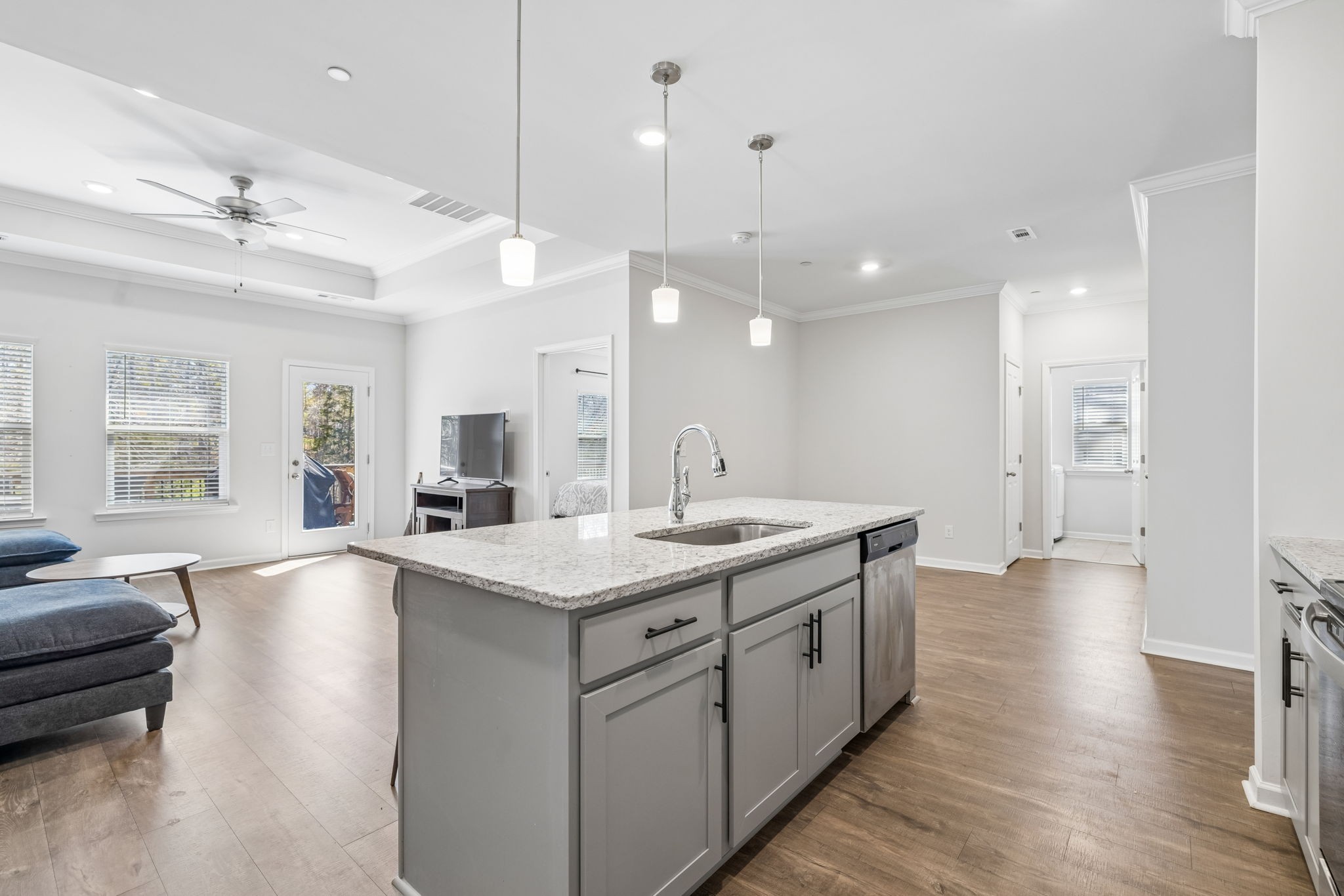 7503 Fernvale Springs Way Fairview, TN 37062 - Photo 24 of 60 a large kitchen with kitchen island a sink a center island a stove and a living room view