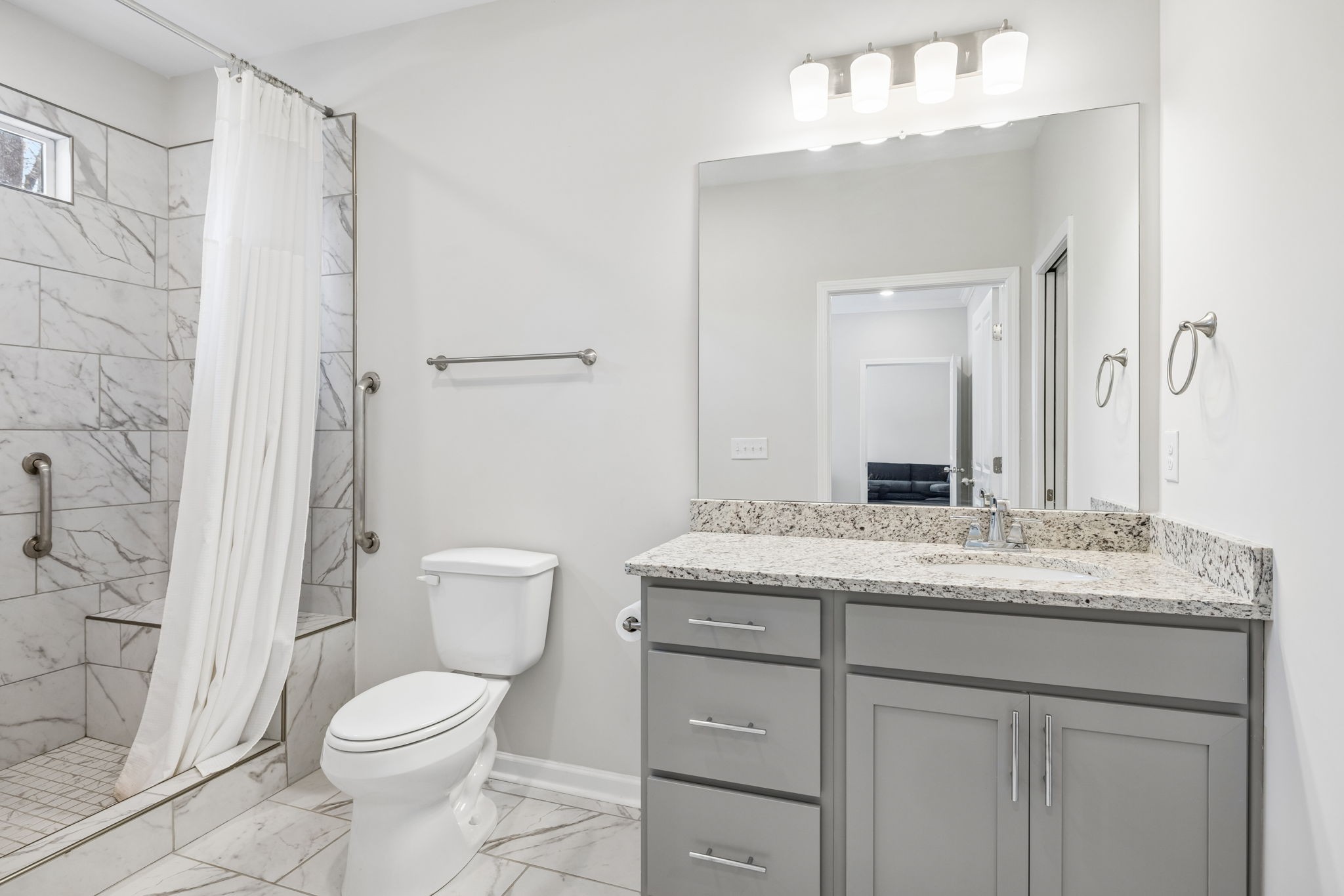 7503 Fernvale Springs Way Fairview, TN 37062 - Photo 33 of 60 a bathroom with a granite countertop sink toilet a mirror a vanity and shower