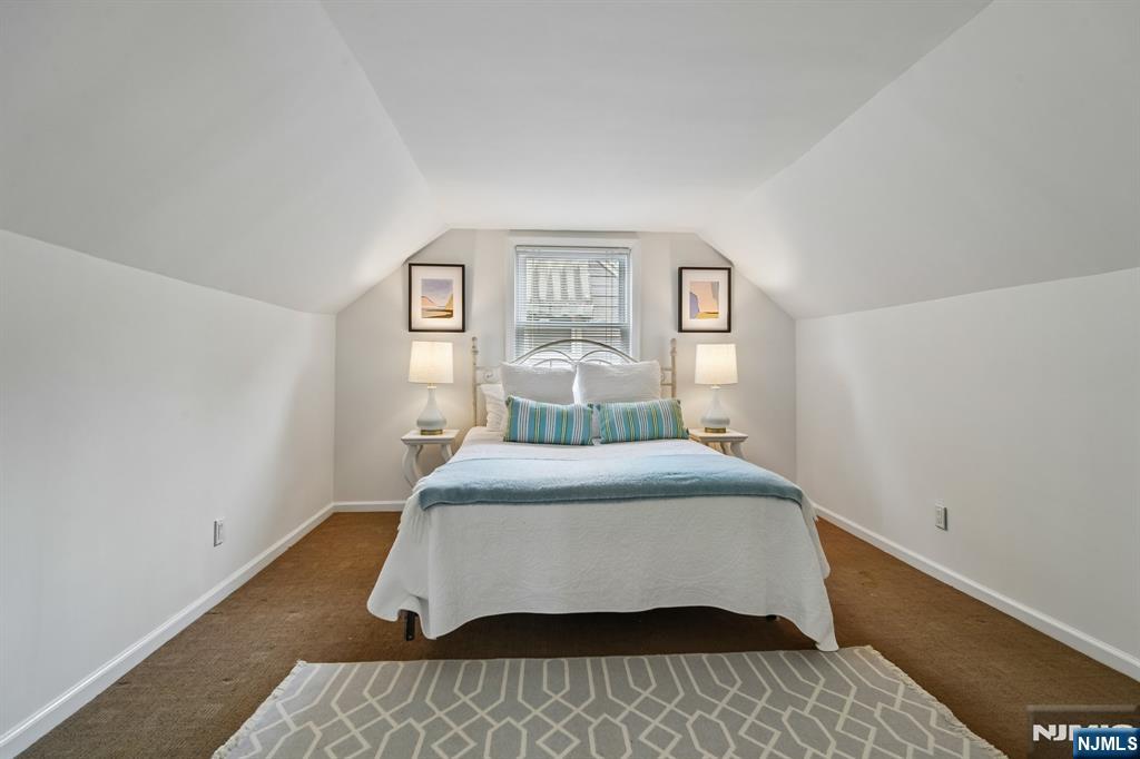 26 Rutgers Place Bloomfield, NJ 07003 - Photo 16 of 38 a bedroom with a bed and window