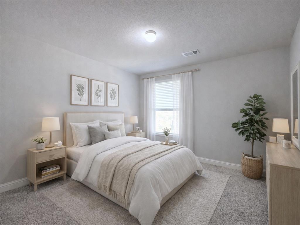 9632 Staffordshire Road Frisco, TX 75035 - Photo 17 of 23 Bedroom with a textured ceiling and light colored carpet