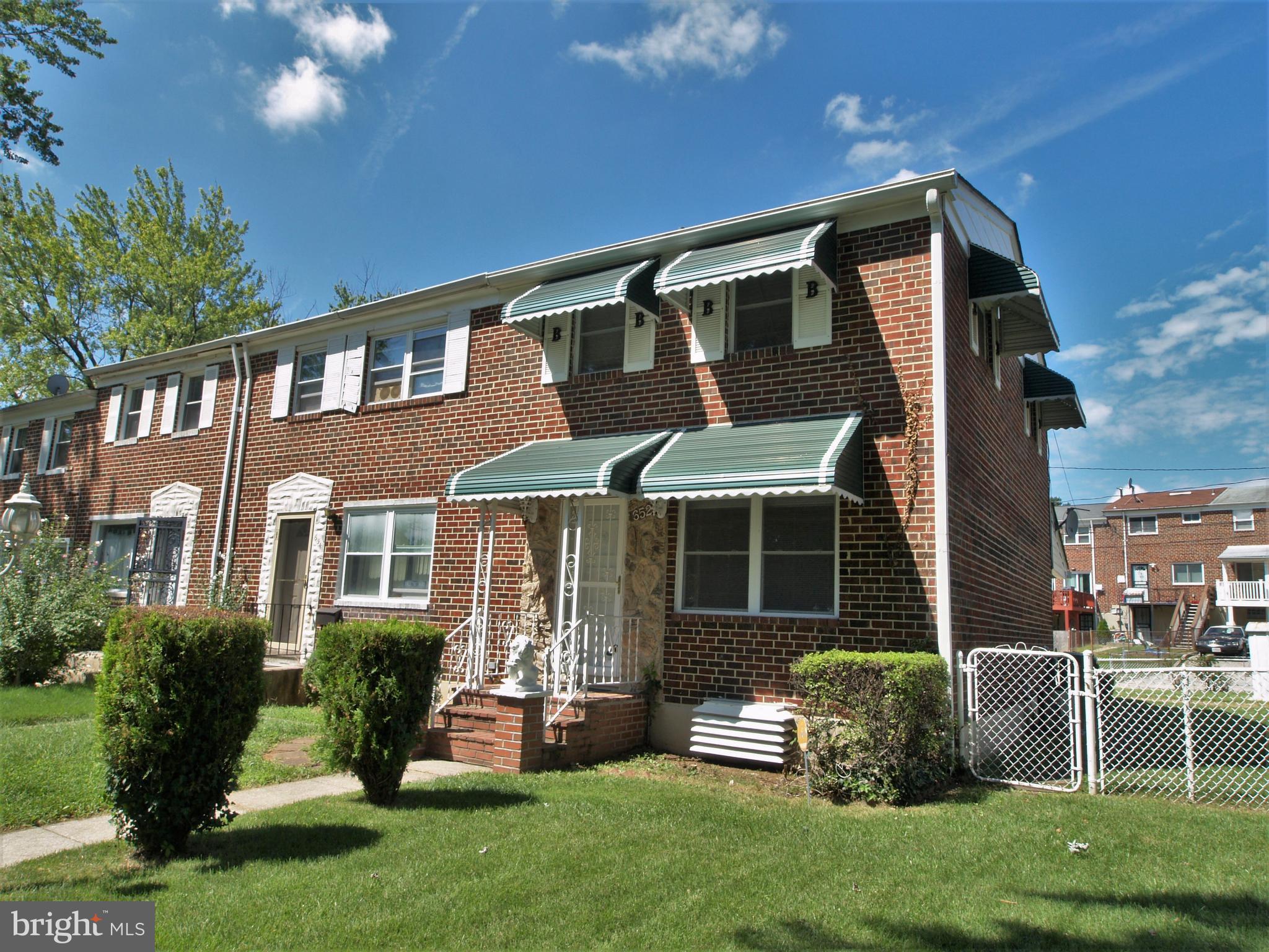 652 Charraway Road Baltimore, MD 21229 - Photo 1 of 22 a front view of a house with a yard and porch