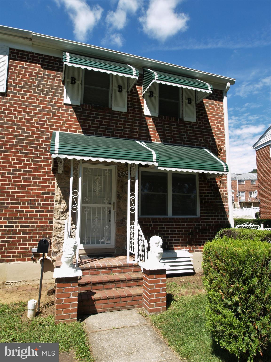 652 Charraway Road Baltimore, MD 21229 - Photo 2 of 22 a front view of a house with garden