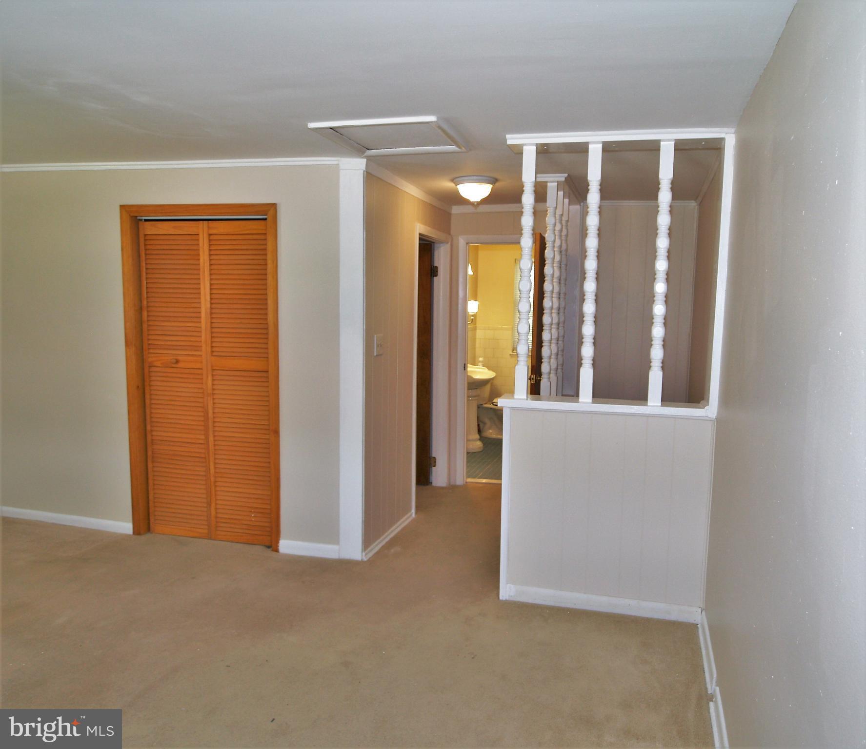 652 Charraway Road Baltimore, MD 21229 - Photo 11 of 22 a view of an empty room with glass door