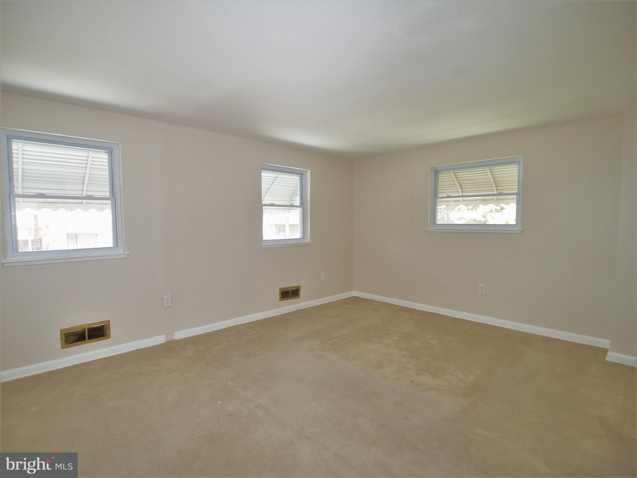 652 Charraway Road Baltimore, MD 21229 - Photo 13 of 22 an empty room with windows