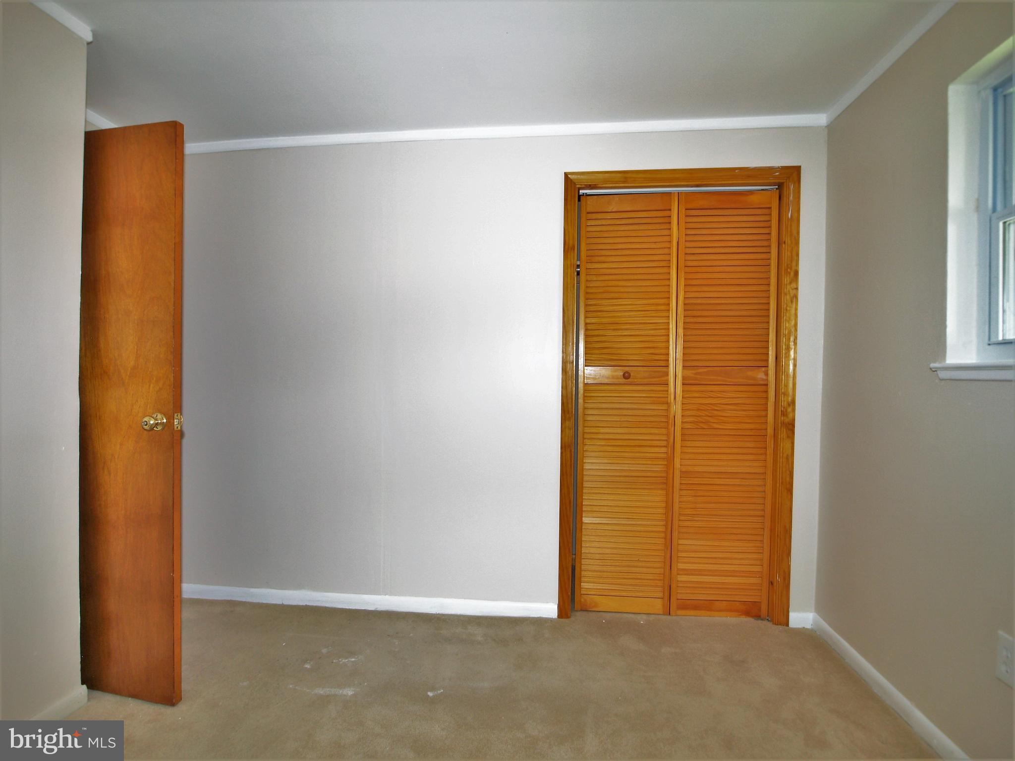 652 Charraway Road Baltimore, MD 21229 - Photo 14 of 22 an empty room with windows
