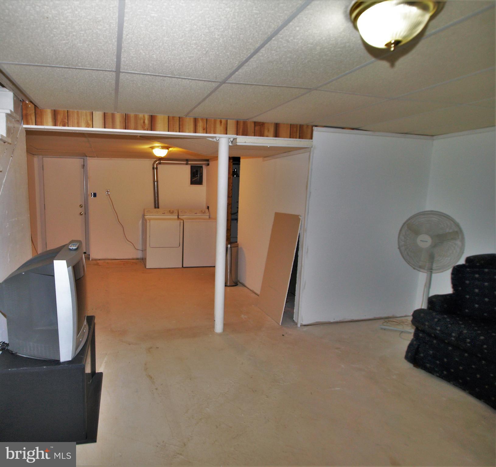 652 Charraway Road Baltimore, MD 21229 - Photo 18 of 22 a view of a livingroom with wooden floor