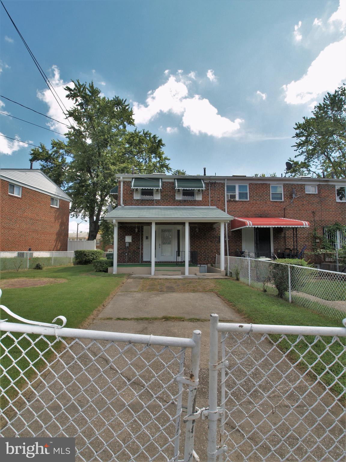652 Charraway Road Baltimore, MD 21229 - Photo 21 of 22 a front view of a house with a garden